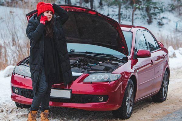 woman with broken down car