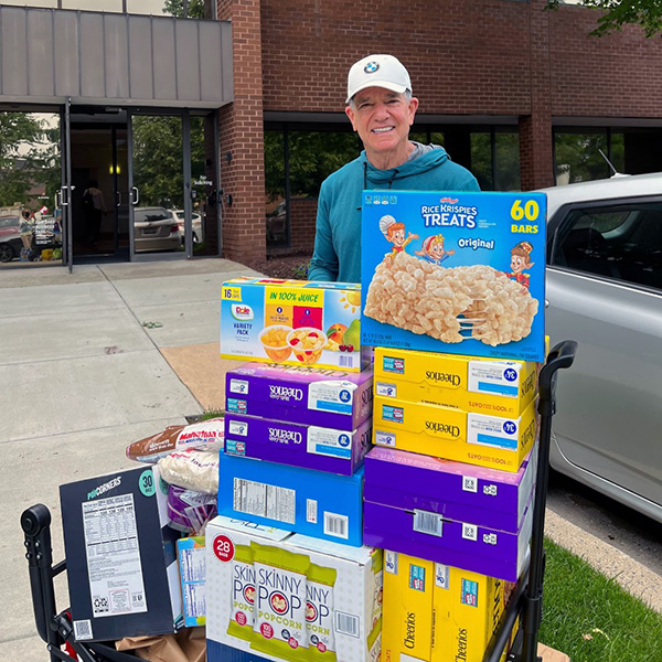 Ken Kozloff with Food Pantry donations