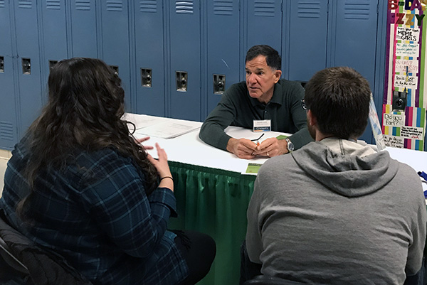 Volunteer Ken Kozloff providing financial coaching