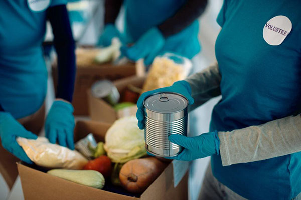 stock image of volunteers with food