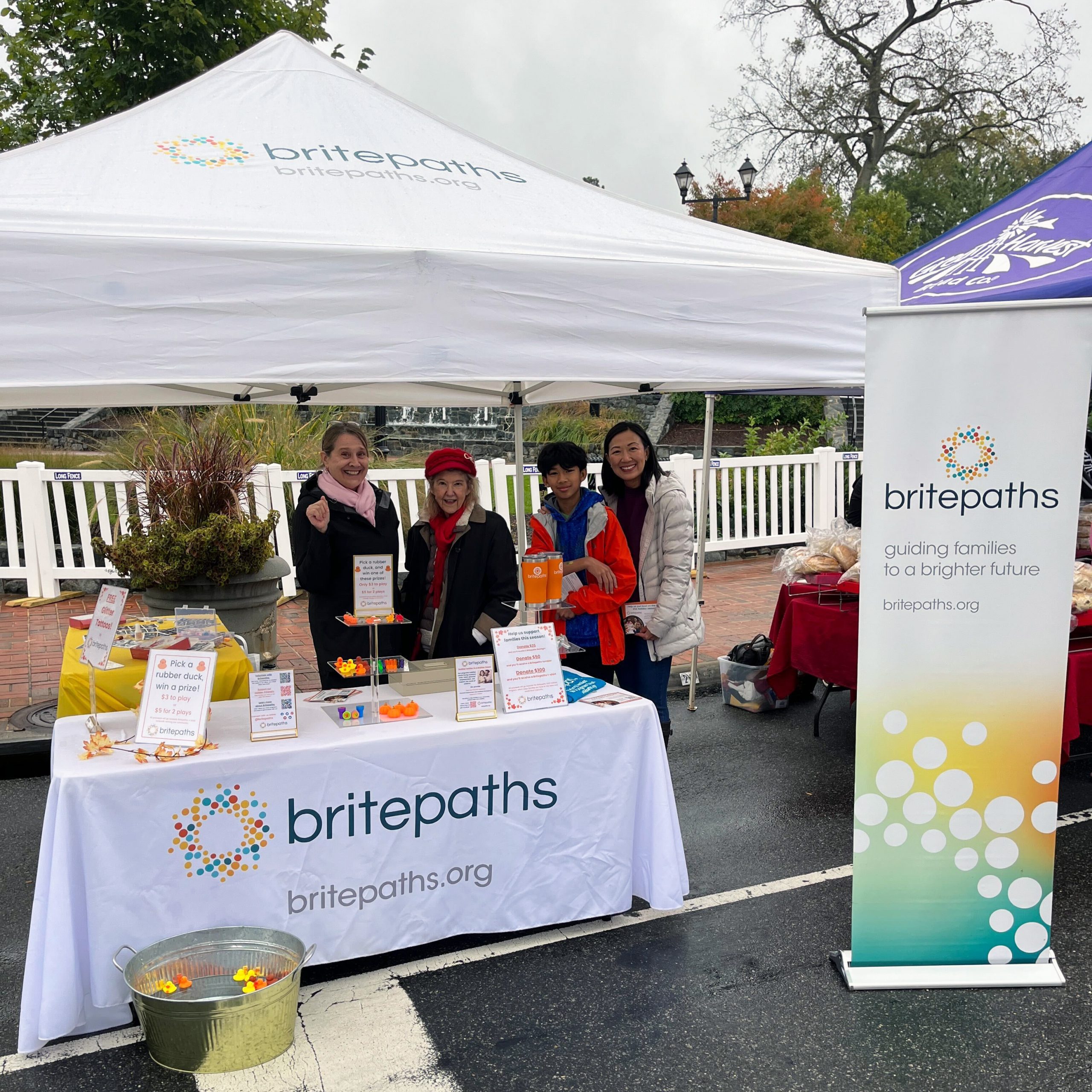 Britepaths volunteers at our Fairfax City Fall Festival table, October 14, 2023