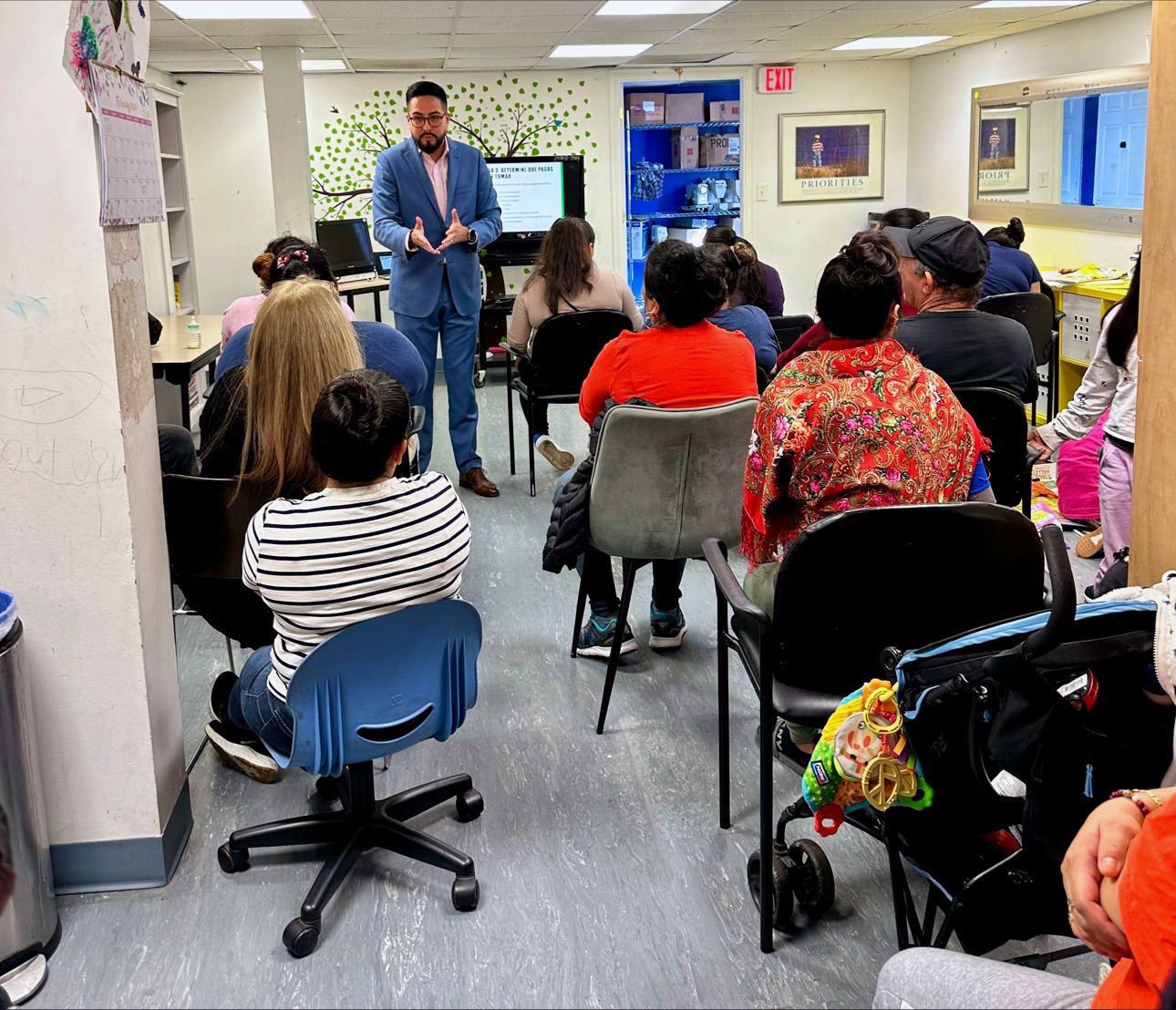 Financial Empowerment Volunteer Steven Carrion leading a workshop for Second Story