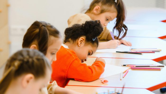 BTS25 group of children writing in a classroom BTS25 group of children writing in a classroom